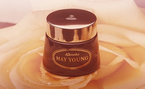 An early Kanebo product in brown packaging featuring the words, “Kanebo” and “MAY YOUNG”.