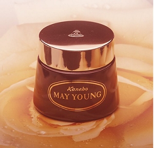 An early Kanebo product in brown packaging featuring the words, “Kanebo” and “MAY YOUNG”.