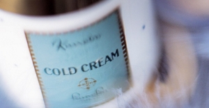 A close-up image of a white bottle of hydrophilic cold cream with a teal label, which reads “Kanebo” and “COLD CREAM”.
