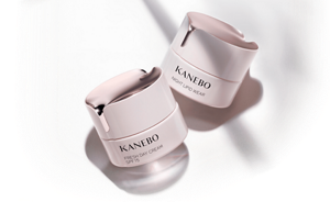 Two soft pink cases with the text, “KANEBO FRESH DAY CREAM SPF 15” written on one and “KANEBO NIGHT LIPID WEAR” on the other.