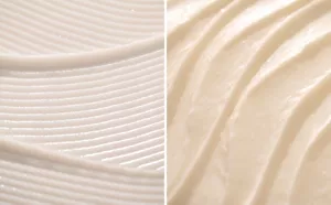 Nourishing Conditioner und Enriching Mask in wellenförmigen Mustern