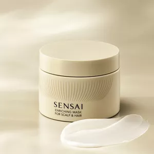 Barattolo di Enriching Mask con una pennellata di crema densa davanti