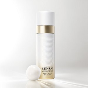 Absolute Silk Micro Mousse Treatment, gold-and-white aerosol can with white mousse texture nearby