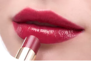 Close-up of a lip wearing Moisture Intense Lipstick in shade MI03 Burgundy Red