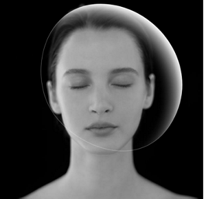 Model with her eyes closed with a veil-like transparnt ellipse over her face.