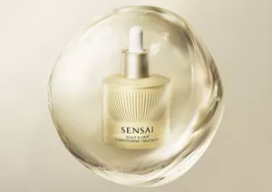 Scalp and Hair Conditioning Treatment centred in a shiny gold orb