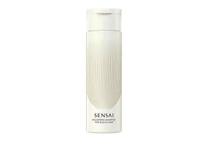 Volumising Shampoo in light beige bottle with gold accents, flip-open cap