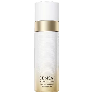 Absolute Silk Micro Mousse Treatment : a white and gold cylindrical aerosol dispenser with a gold gradient gold and a pull-off cap