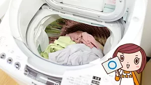 写真:良い事例 洗濯槽の7割程度まで洗濯物が入った洗濯機