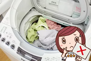 写真:悪い事例 洗濯槽からはみ出るほど洗濯物が入った洗濯機