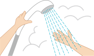 介助者が手でシャワーの湯温を確かめているイラスト