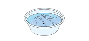 衣類をつけ置きしている様子のイラスト