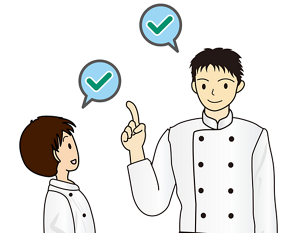 二人の従業員がお互いの身だしなみをチェックしている様子のイラスト。