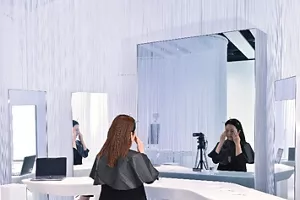 Scene of an experiment on analyzing motions associated with putting on makeup by using motion capture technology