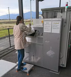 Used disposable diapers being fed into the carbonization device
