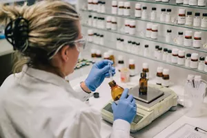 A researcher blending fragrance ingredients