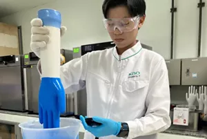 Two researchers reviewing experimental samples together