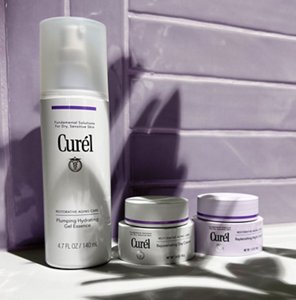 Curél Restorative Aging Care range of products against a purple tiled background