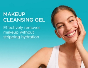 Woman with nourished skin against a teal background