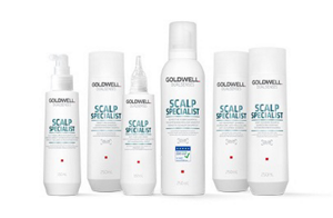 zes Goldwell producten in witte flacons voor een witte achtergrond