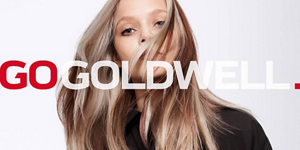 Woman with blonde hair in front of bright background and Go Goldwell logo in front