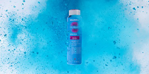 A bottle of Goldwell Colorance Cover Plus 8NN in a plume of blue color
