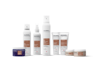 eight goldwell stylesign texture products lined up horizontally in a row on a white background