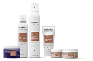 eight goldwell stylesign texture products lined up horizontally in a row on a white background