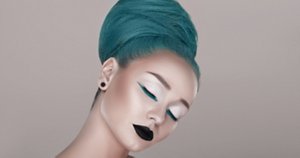 creative and futuristic look of fashion woman with green hair