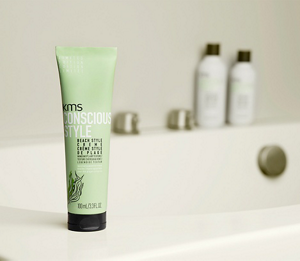 KMS consciousstyle beach style creme standing on the edge of a bathtub