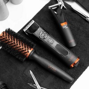 VARIS hair trimmer and hair clipper laid out next to other hair products