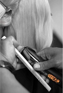Hair being styled using VARIS hair clipper and comb