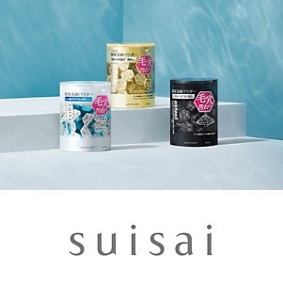 Four suisai products of various sizes positioned side-by-side on top of a textured, light grey background. 