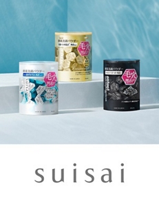 Four suisai products of various sizes positioned side-by-side on top of a textured, light grey background. 