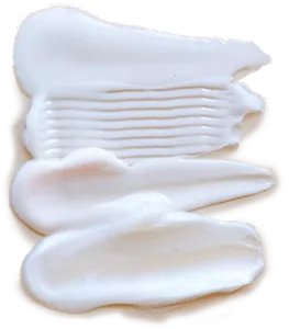 Texture shot showing four different products on a beige background