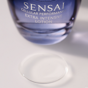 Cellular Performance Extra Intensive Lotion bottle with a clear lotion droplet in front on a pale background