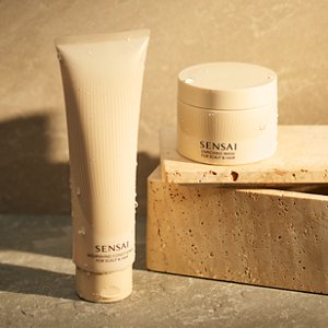 Nourishing conditioner and enriching mask arranged together, mask set on a block