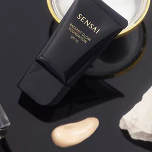 Shiny black tube showcased with texture on black surface