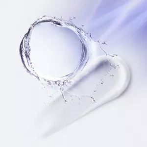 A splash of water forming a circular shape on a smooth cream, light blue background with flowing motion