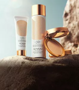 SILKY BRONZE products showcased against a vibrant sunset background.