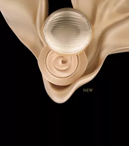 Ultimate The Foundation jar open with silky foundation swirl on gold drape background