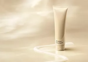 Nourishing Conditioner tube surrounded by a ribbon of cream texture