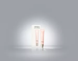 Total Lip Treatment tube in soft pink with twist cap placed in front of white box