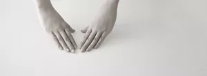 Two hands positioned palm down, prepared to start a skincare routine