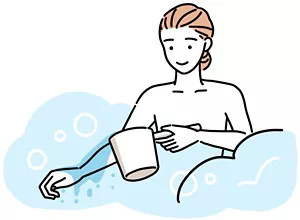 手に冷たい水をかけている女性のイラストイメージ