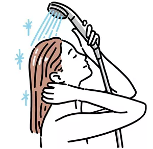 髪の毛を冷水ですすいでいる女性のイラストイメージ