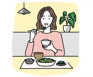 朝食を食べている女性のイラストイメージ