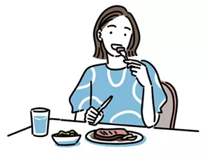 冷えに効果的な食材を食べている女性のイラストイメージ