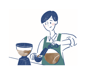 コーヒーをカップに入れる男性