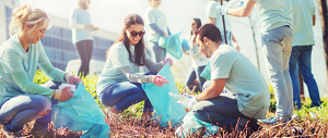 Large group of KAO employees at a volunteer event wearing bright blue shirts.